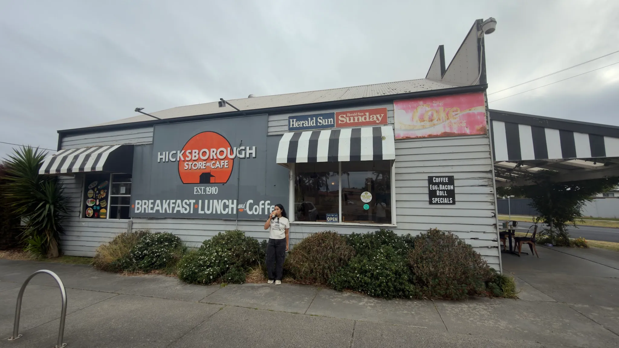 Hicksborough Store and Cafe exterior on an overcast day with customer standing outside