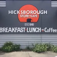 Hicksborough Store and Cafe orange circle logo sign on the exterior weatherboard wall